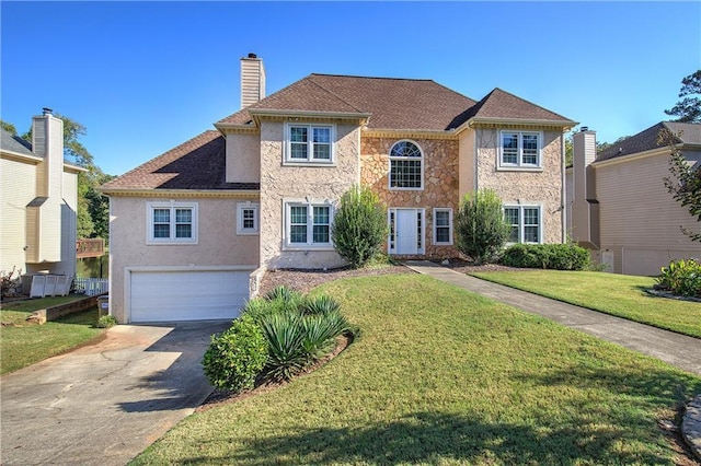 view of front of home with an attached garage, stone siding, concrete driveway, a chimney, and a front yard