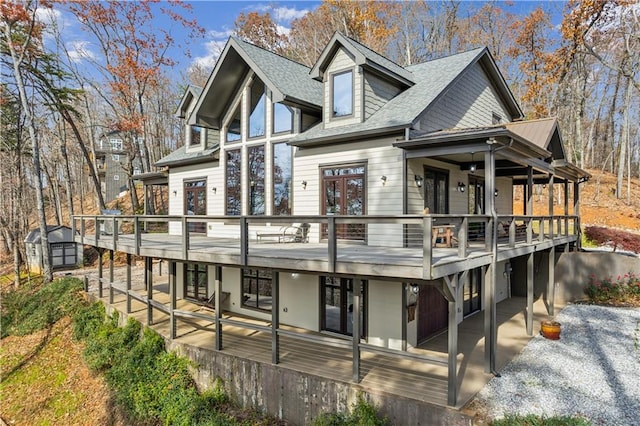 view of front facade with a patio area and a deck