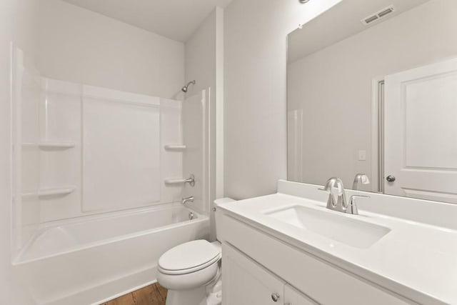 bathroom featuring bathtub / shower combination, toilet, wood finished floors, vanity, and visible vents