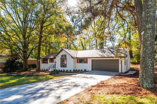 single story home with a garage