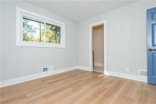 empty room with light wood-type flooring