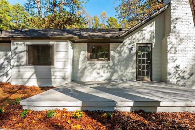 doorway to property featuring a wooden deck