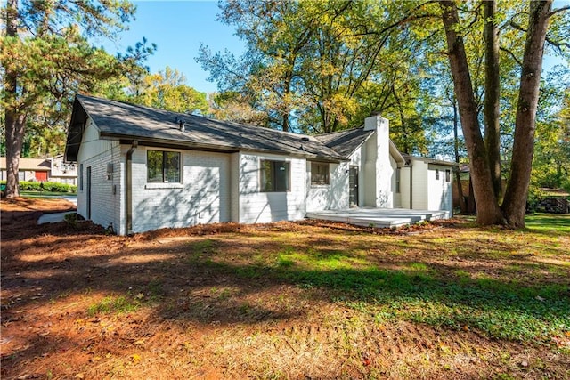 view of side of property with a patio