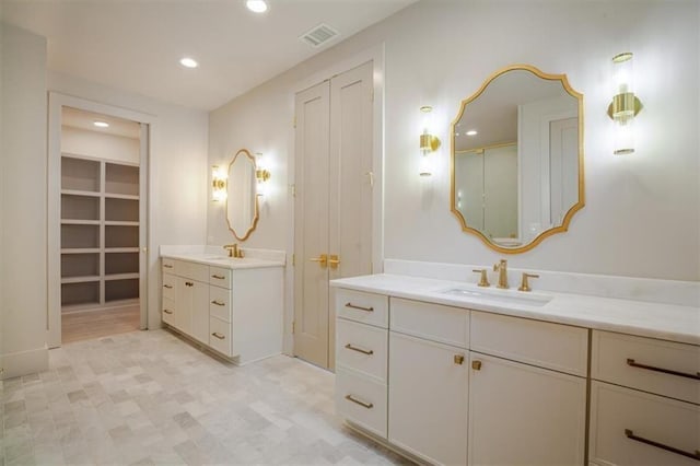 bathroom with a sink, visible vents, two vanities, and recessed lighting