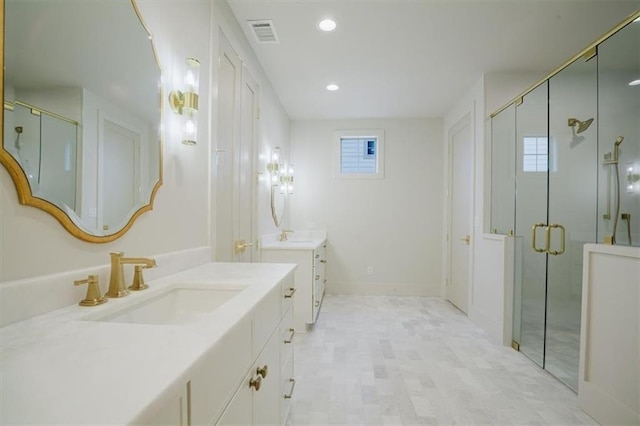 bathroom with a sink, visible vents, two vanities, and a shower stall
