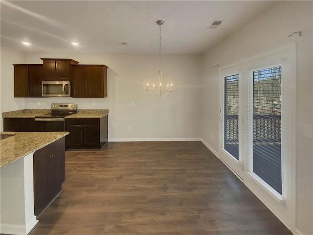 kitchen featuring light stone counters, dark wood-style flooring, stainless steel appliances, dark brown cabinetry, and a chandelier