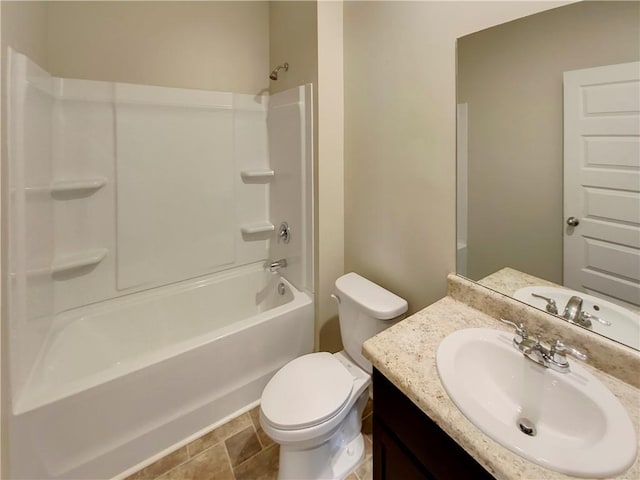 bathroom with bathtub / shower combination, vanity, and toilet