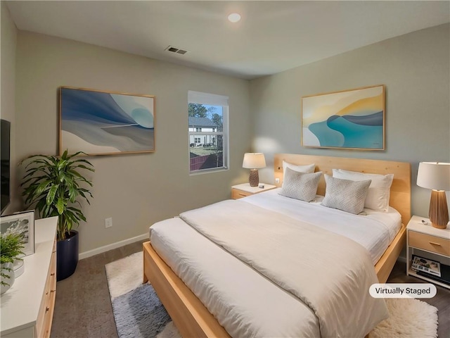 bedroom with visible vents and baseboards