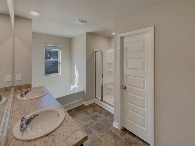 full bathroom featuring double vanity, a sink, visible vents, and a shower stall