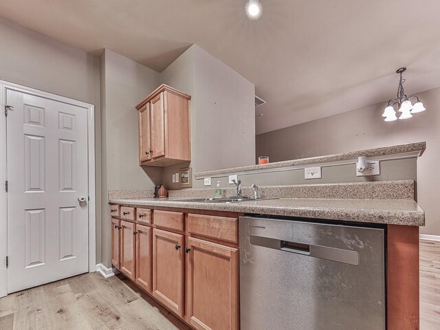 kitchen with hanging light fixtures, sink, stainless steel dishwasher, a chandelier, and light wood-type flooring