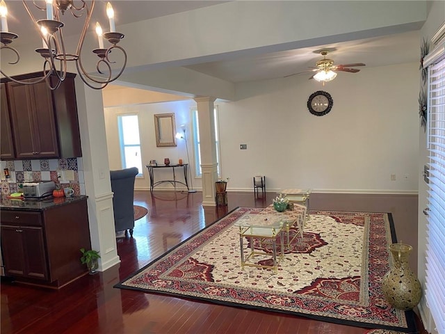 3692 Archgate Ct, Alpharetta, GA 30004 - dining space featuring ornate columns, a ceiling fan, dark wood-style flooring, a chandelier, and baseboards