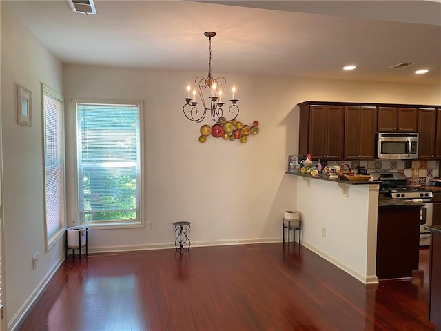 3692 Archgate Ct, Alpharetta, GA 30004 - kitchen with appliances with stainless steel finishes, dark countertops, dark wood-style floors, healthy amount of natural light, and recessed lighting