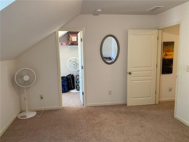 3692 Archgate Ct, Alpharetta, GA 30004 - unfurnished bedroom featuring carpet flooring, a spacious closet, lofted ceiling, and baseboards