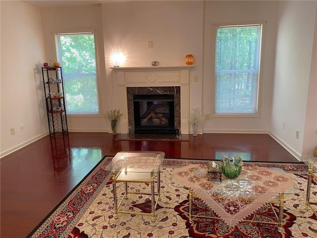 3692 Archgate Ct, Alpharetta, GA 30004 - living room featuring a fireplace, baseboards, and wood finished floors