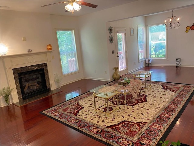 3692 Archgate Ct, Alpharetta, GA 30004 - living room featuring wood finished floors, ceiling fan, a fireplace, a chandelier, and baseboards