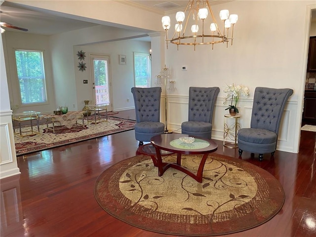 3692 Archgate Ct, Alpharetta, GA 30004 - living area featuring wood finished floors, ornamental molding, a chandelier, a decorative wall, and a wainscoted wall