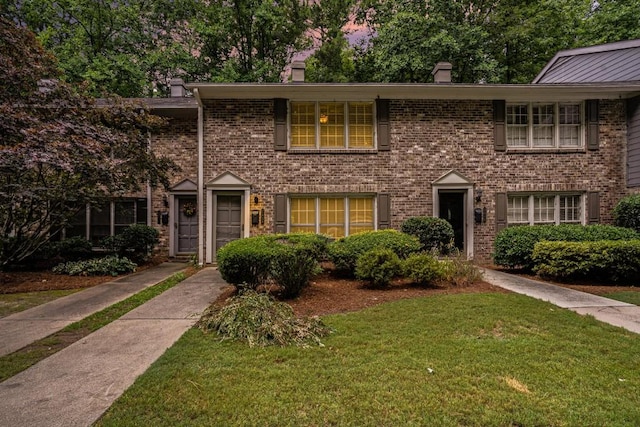 view of front of house with a yard