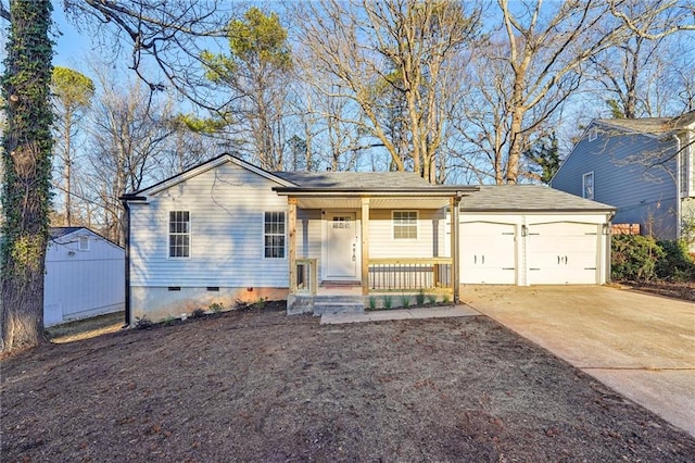 single story home with a garage, a porch, and a shed