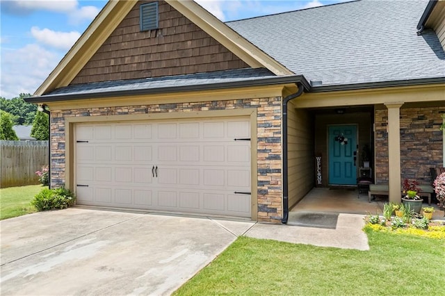 108 Lake Point Ct, Jefferson, GA 30549 - view of front of property with stone siding, concrete driveway, roof with shingles, and an attached garage