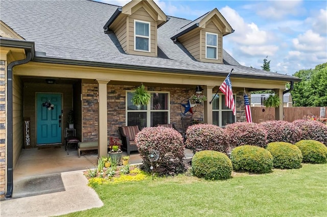 108 Lake Point Ct, Jefferson, GA 30549 - doorway to property featuring covered porch, roof with shingles, and stone siding