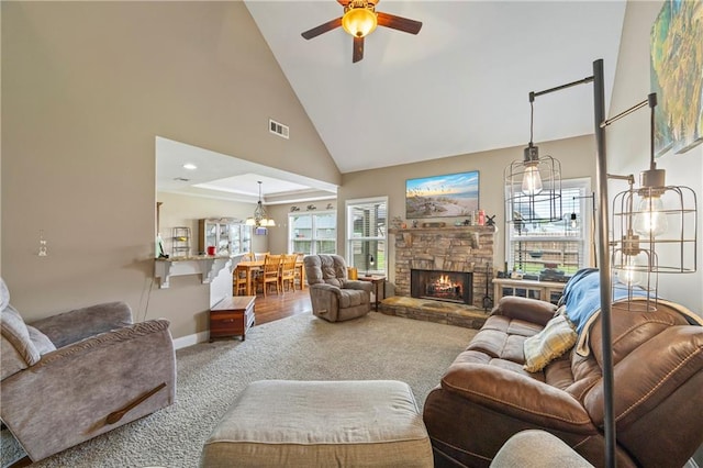108 Lake Point Ct, Jefferson, GA 30549 - living area with carpet floors, ceiling fan, high vaulted ceiling, and a stone fireplace
