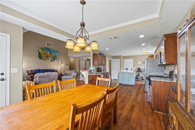 108 Lake Point Ct, Jefferson, GA 30549 - dining space featuring dark wood-style floors, a chandelier, crown molding, a textured ceiling, and recessed lighting