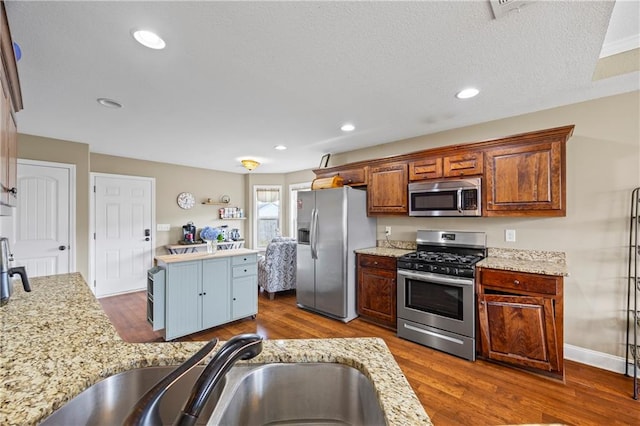 108 Lake Point Ct, Jefferson, GA 30549 - kitchen with appliances with stainless steel finishes, dark wood-style flooring, light stone countertops, and recessed lighting