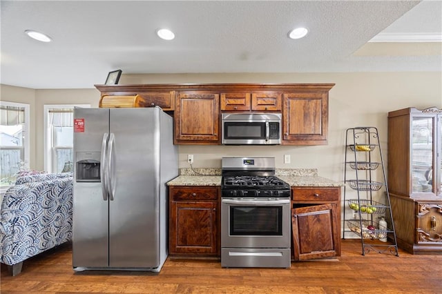 108 Lake Point Ct, Jefferson, GA 30549 - kitchen with appliances with stainless steel finishes, plenty of natural light, light stone countertops, and recessed lighting