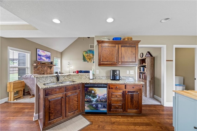 108 Lake Point Ct, Jefferson, GA 30549 - kitchen with dishwasher, dark wood-type flooring, a peninsula, open floor plan, and light stone countertops