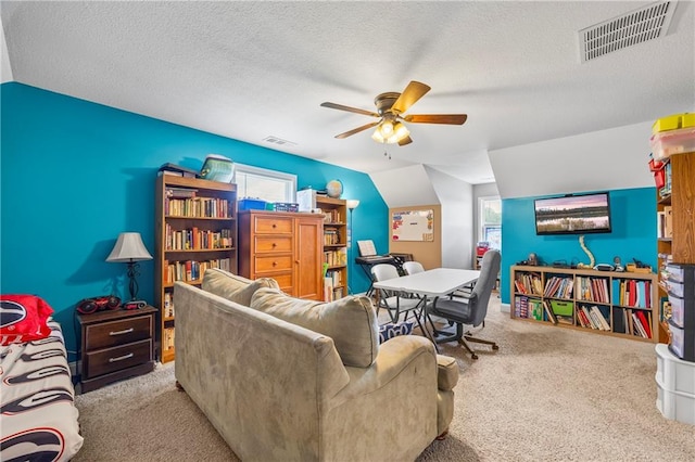 108 Lake Point Ct, Jefferson, GA 30549 - carpeted living room featuring a ceiling fan, healthy amount of natural light, and a textured ceiling