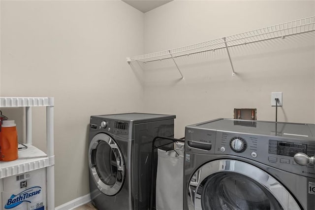 8553 Braylen Manor Dr, Douglasville, GA 30134 - laundry room with independent washer and dryer and baseboards