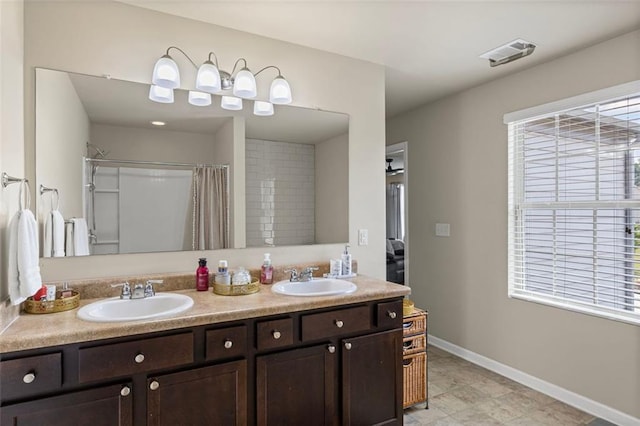 8553 Braylen Manor Dr, Douglasville, GA 30134 - full bathroom featuring double vanity and curtained shower