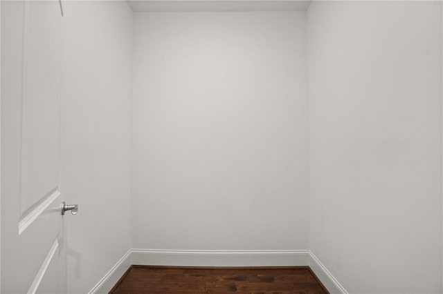 empty room with dark wood-type flooring