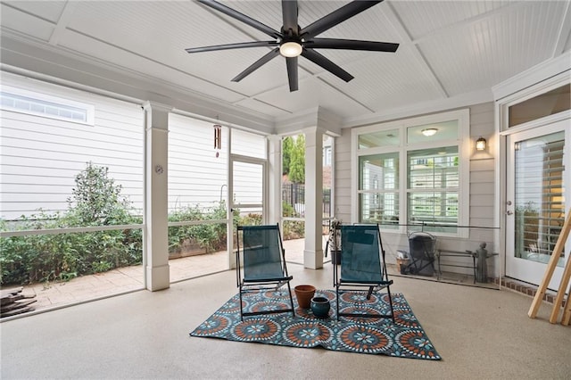 sunroom / solarium featuring ceiling fan and a healthy amount of sunlight