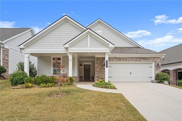 craftsman-style house featuring a garage and a front yard