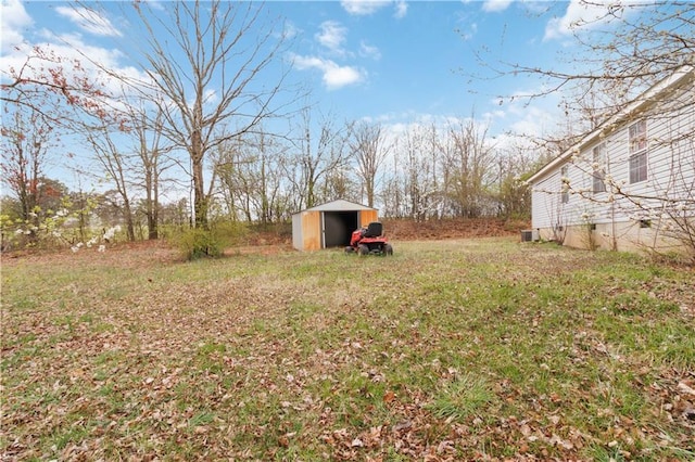 view of yard featuring a storage shed and an outdoor structure