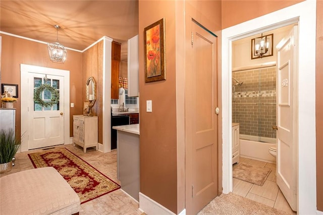 791 E Main St, Canton, GA 30114 - foyer featuring a chandelier, light tile patterned floors, and baseboards