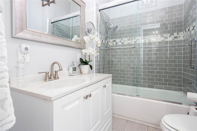 791 E Main St, Canton, GA 30114 - bathroom featuring vanity, toilet, enclosed tub / shower combo, and tile patterned flooring