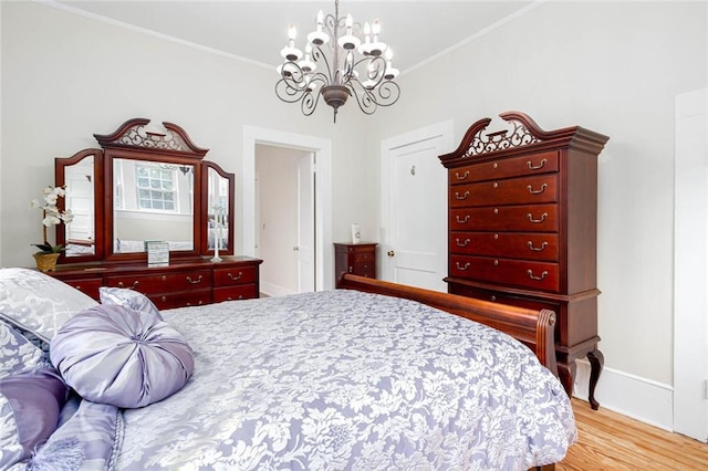 791 E Main St, Canton, GA 30114 - bedroom featuring a chandelier, light wood-style flooring, crown molding, and baseboards