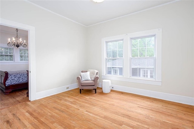 791 E Main St, Canton, GA 30114 - sitting room with ornamental molding, light wood-style floors, baseboards, and a chandelier