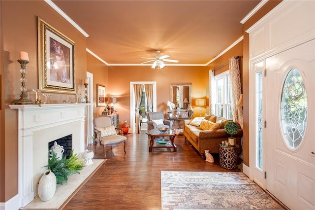 791 E Main St, Canton, GA 30114 - entryway featuring wood finished floors, crown molding, ceiling fan, and a fireplace with flush hearth