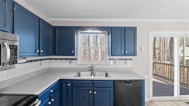 kitchen with black dishwasher, tasteful backsplash, blue cabinets, light countertops, and a sink