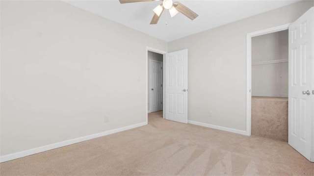 unfurnished bedroom featuring ceiling fan, carpet floors, a closet, and baseboards