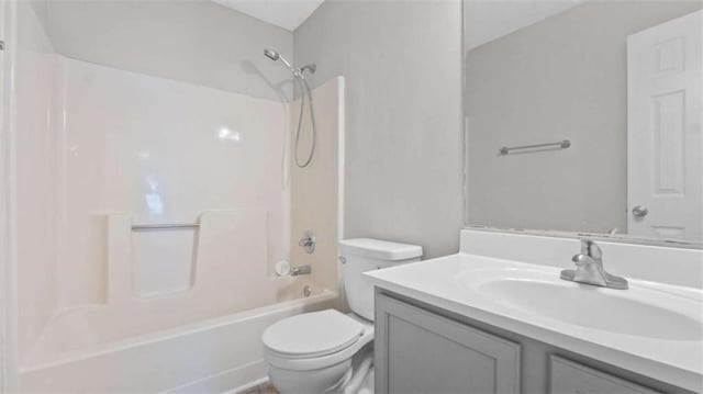 bathroom with  shower combination, vanity, and toilet