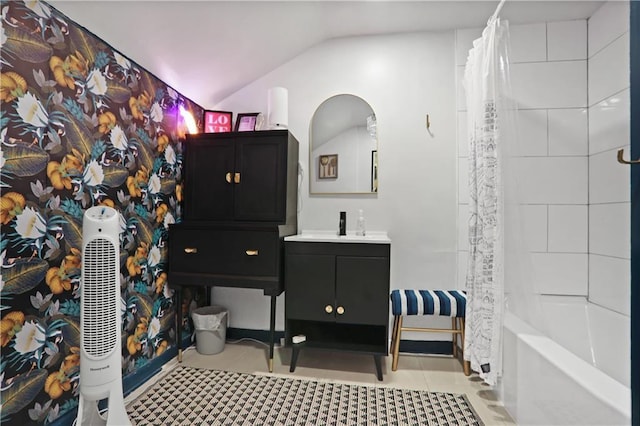 1202 Key Rd SE, Atlanta, GA 30316 - bathroom featuring lofted ceiling, vanity, and shower / bathtub combination with curtain