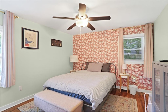 1202 Key Rd SE, Atlanta, GA 30316 - bedroom featuring dark wood-type flooring, baseboards, wallpapered walls, and ceiling fan