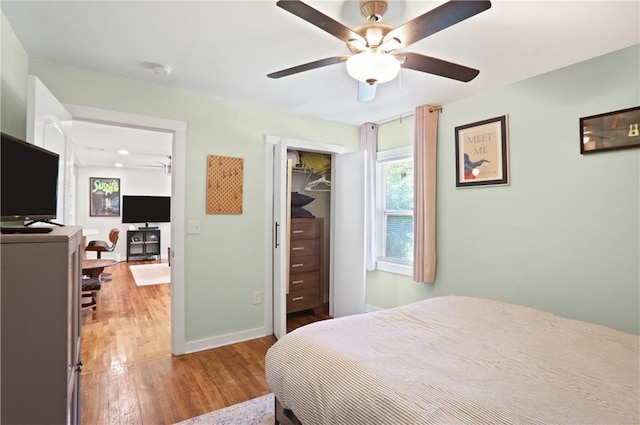 1202 Key Rd SE, Atlanta, GA 30316 - bedroom with wood finished floors, baseboards, a closet, and a ceiling fan