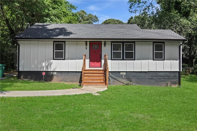 1202 Key Rd SE, Atlanta, GA 30316 - view of front facade featuring entry steps, board and batten siding, a front yard, roof with shingles, and crawl space