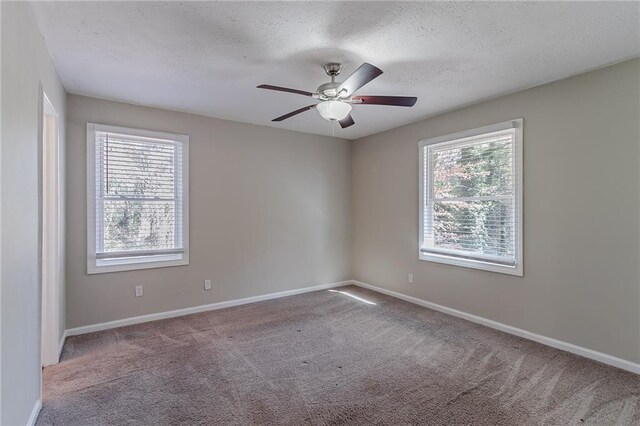 2329 Meadowlane Dr SW, Atlanta, GA 30311 - spare room with a textured ceiling, ceiling fan, and light carpet
