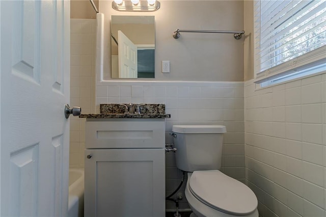 2329 Meadowlane Dr SW, Atlanta, GA 30311 - bathroom with vanity, toilet, and tile walls